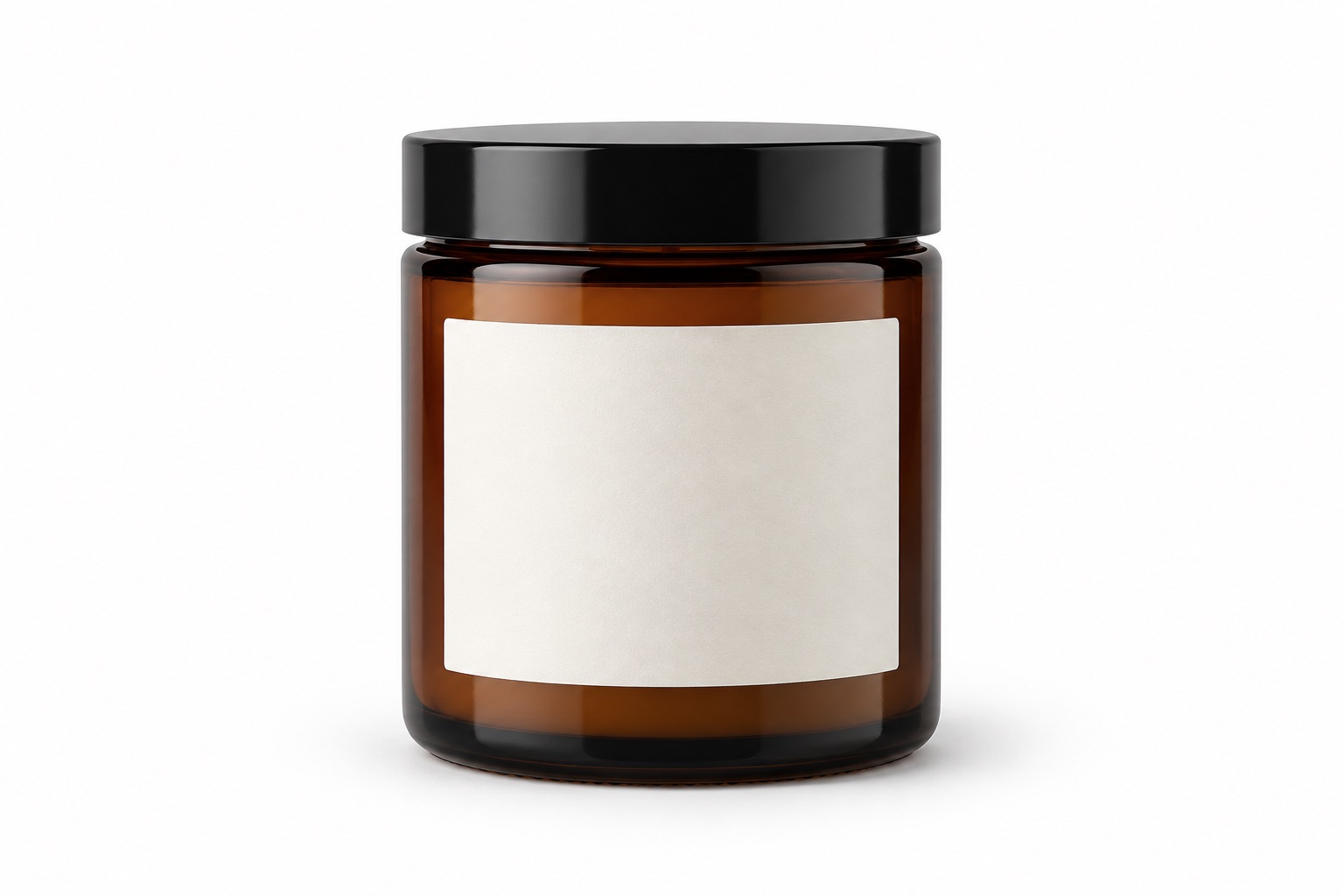 AI-created amber candle jar with black lid and blank ivory label on a white background